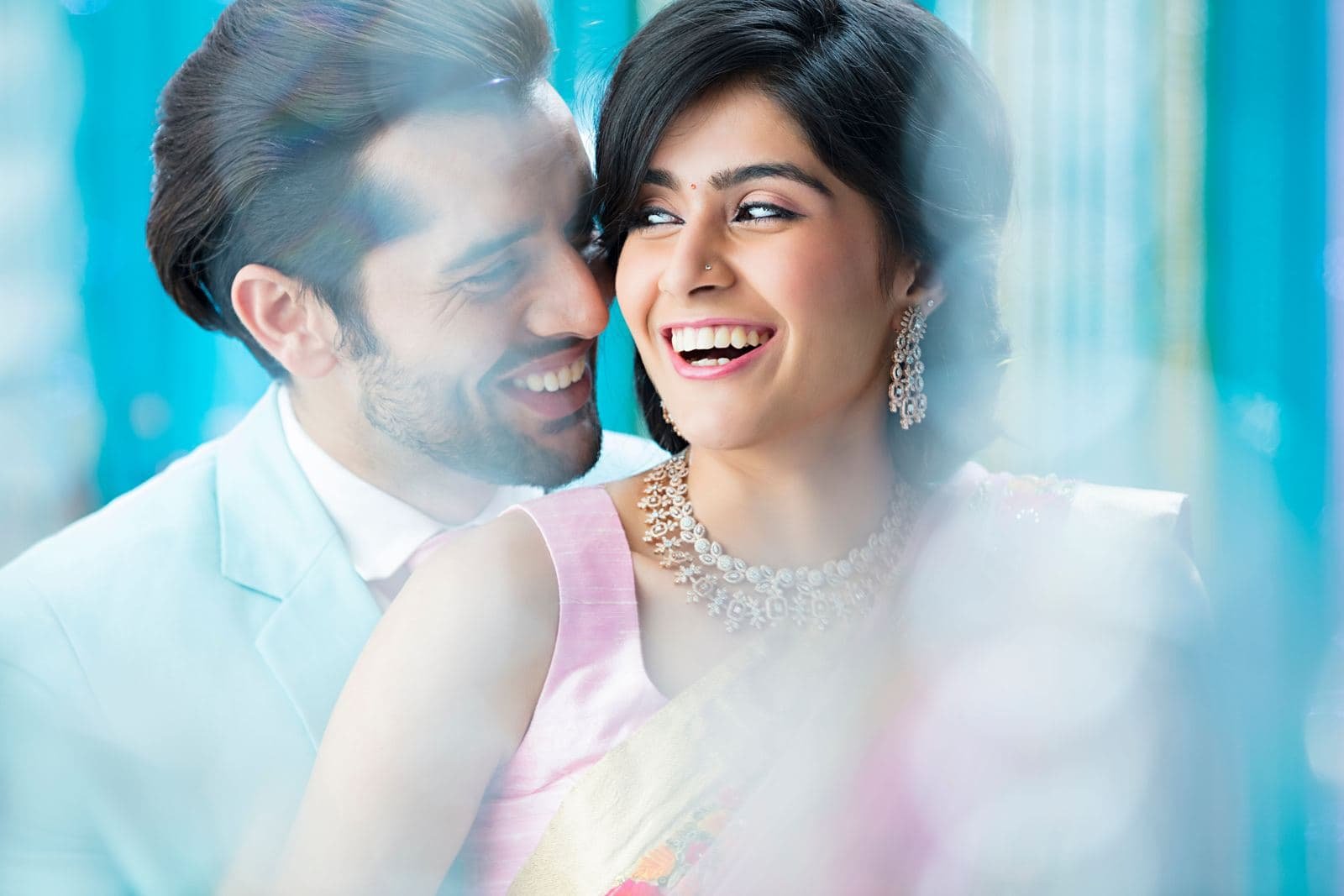 Close-up of an engaged couple laughing together