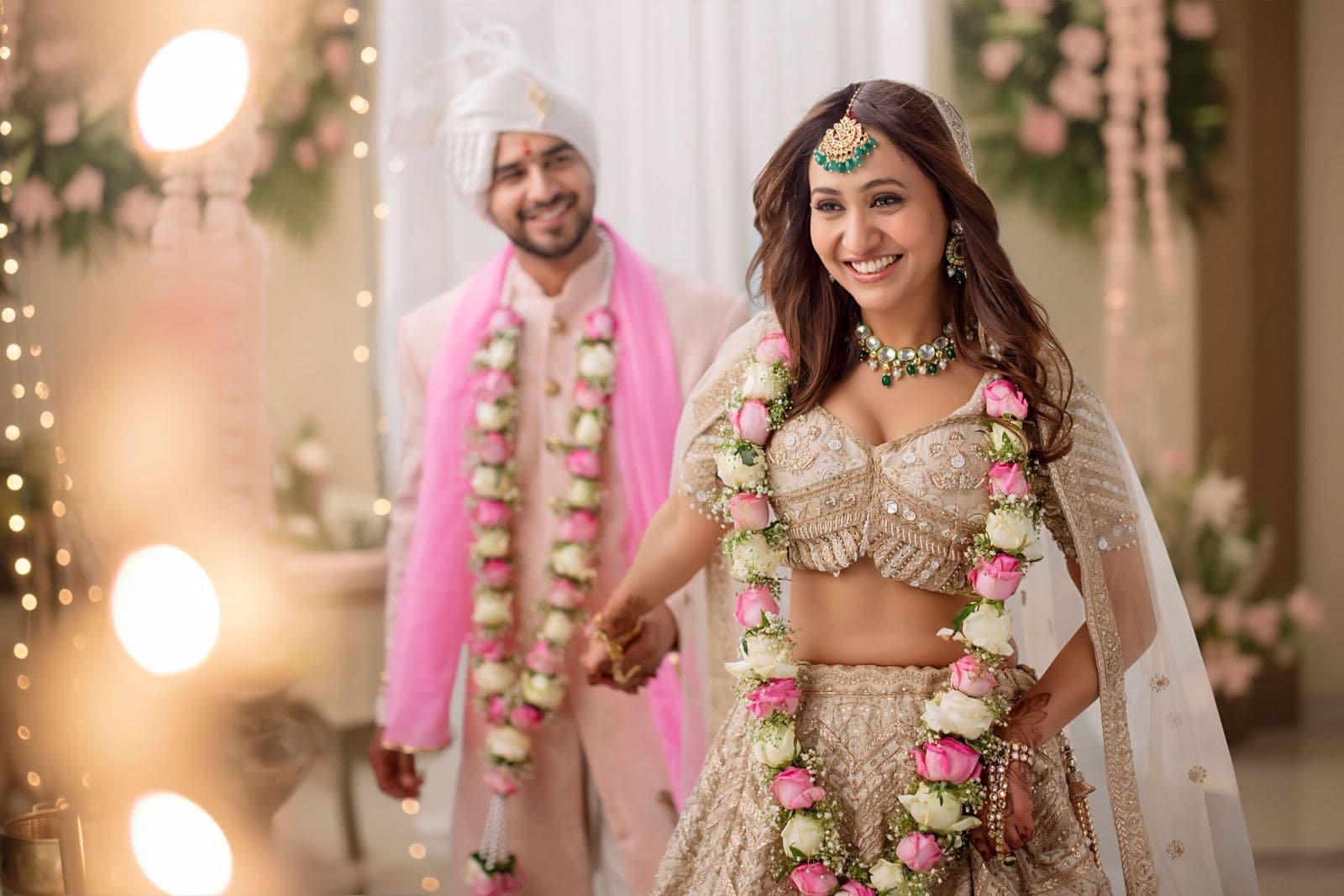 Couple exchanging flower garlands at a ring ceremony